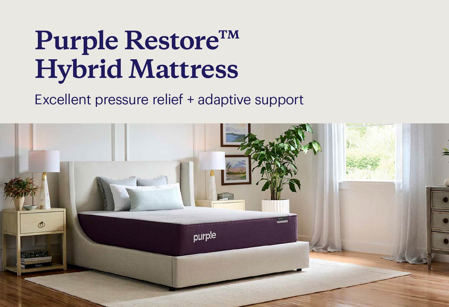 Key features of the Purple Restore™ Hybrid shown with the mattress on an upholstered bedframe with pillows and bedroom furniture