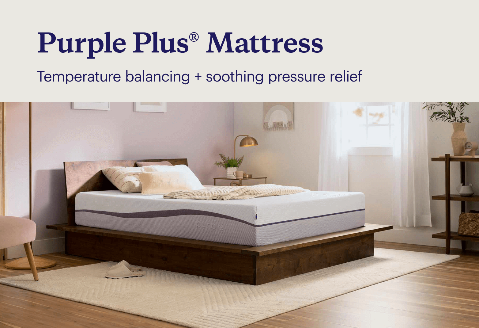 Key features of the Purple Plus® mattress shown with the unmade mattress on a modern wood bed frame in a boho bedroom.