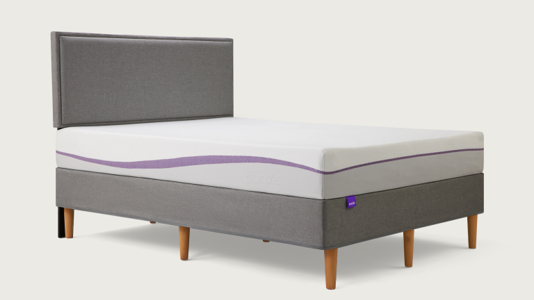 purple bed frame with mattress