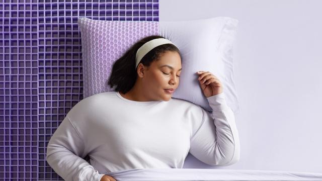 Woman on Half Exposed Grid Mattress and pillow