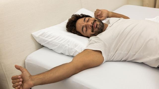 Man using Purple Pillow