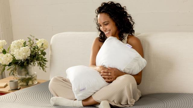 Woman hugging a TwinCloud pillow