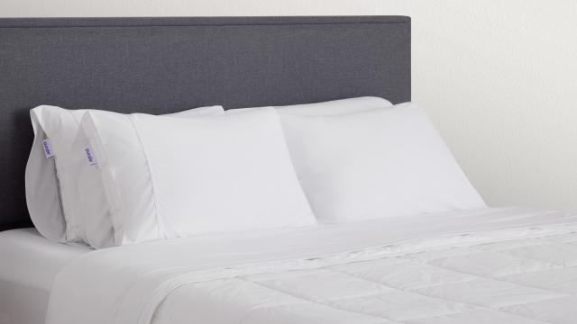 cloud pillows on made bed