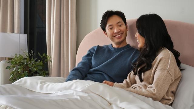 Happy couple laying in bed