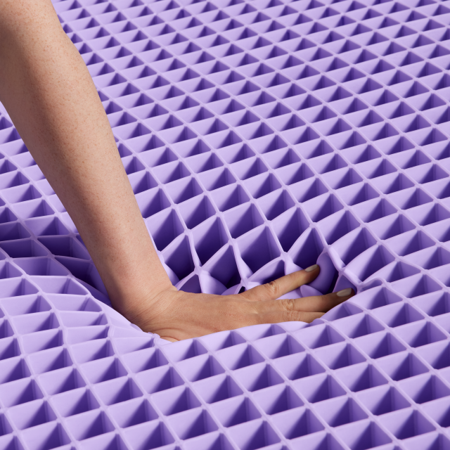 Hand pressing into the purple gelflex grid