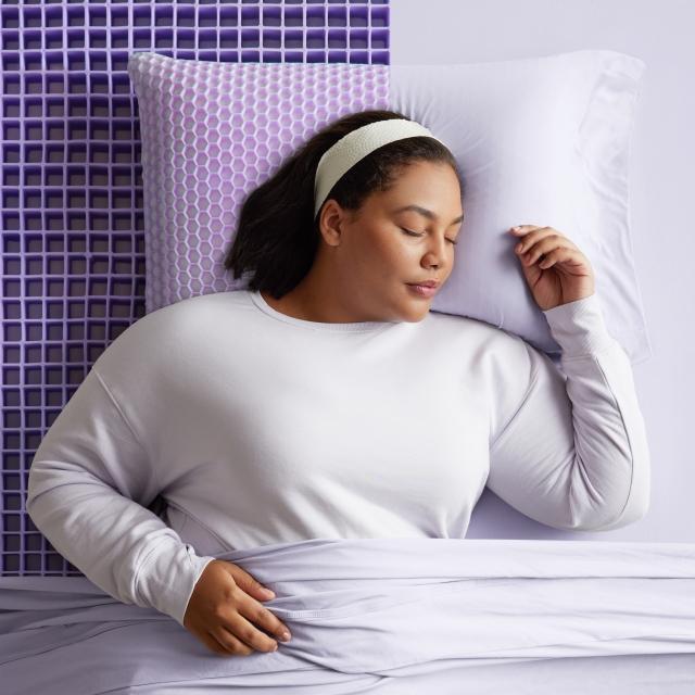 woman on purple mattress with grid exposec