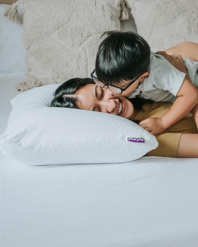 Mother and son on Purple bedding