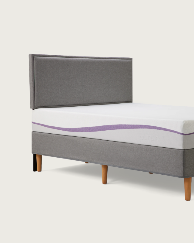 purple bed frame with mattress