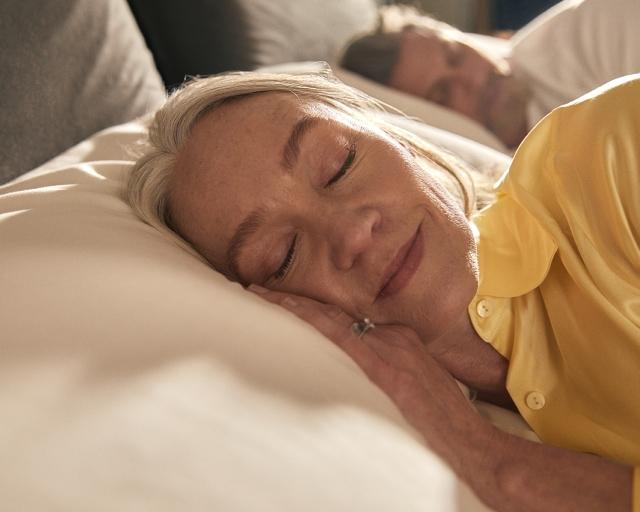 Woman laying on mattress