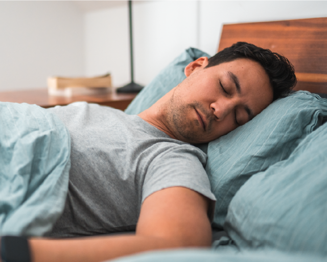 Man sleeping in bed