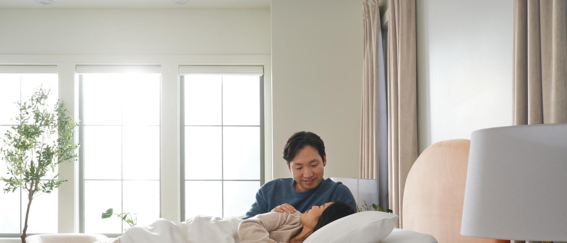 Happy couple laying in bed