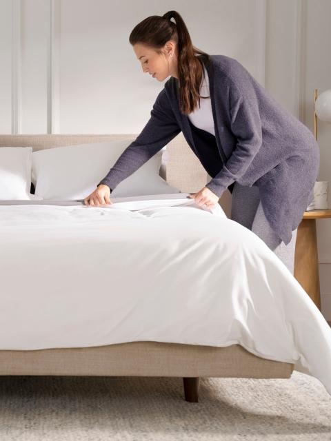Woman Using Purple Duvet